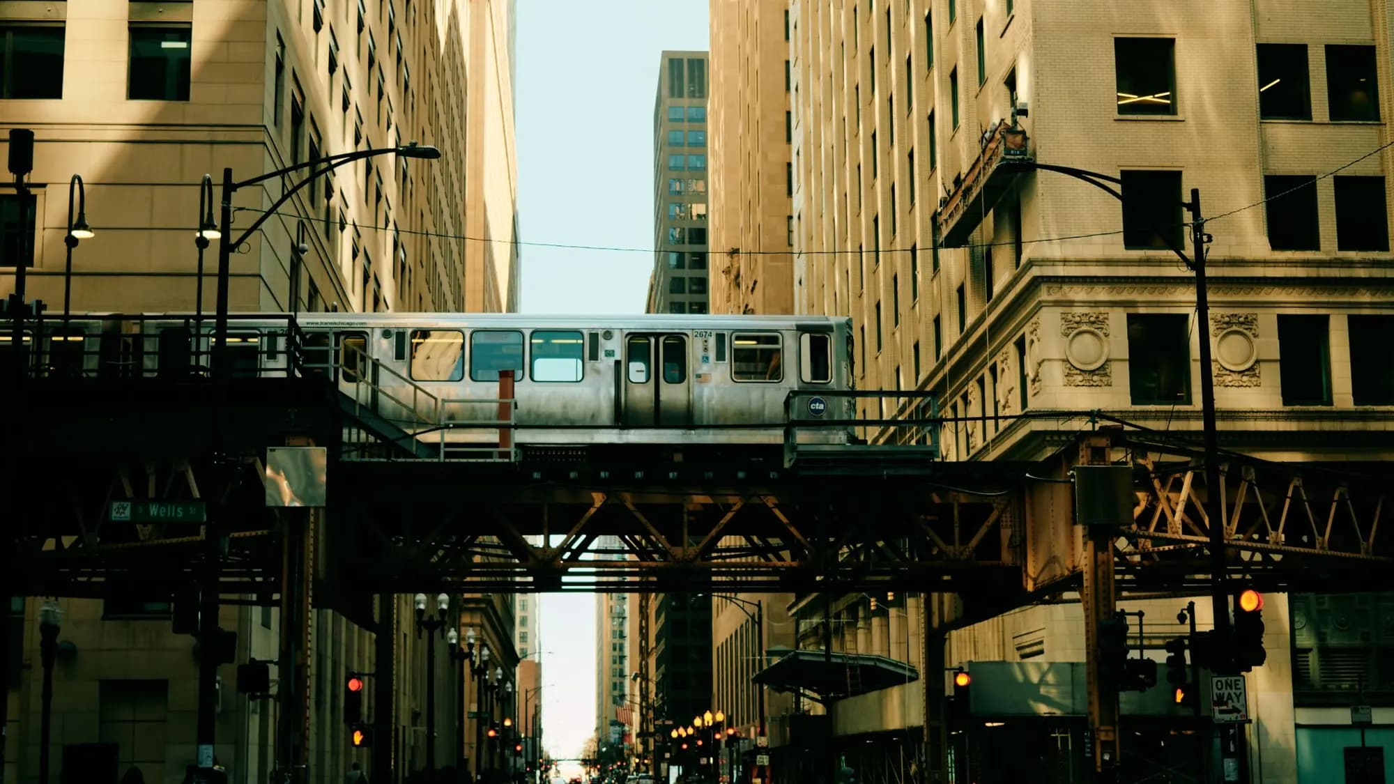 Downtown Chicago street below the elevated train tracks at lunchtime