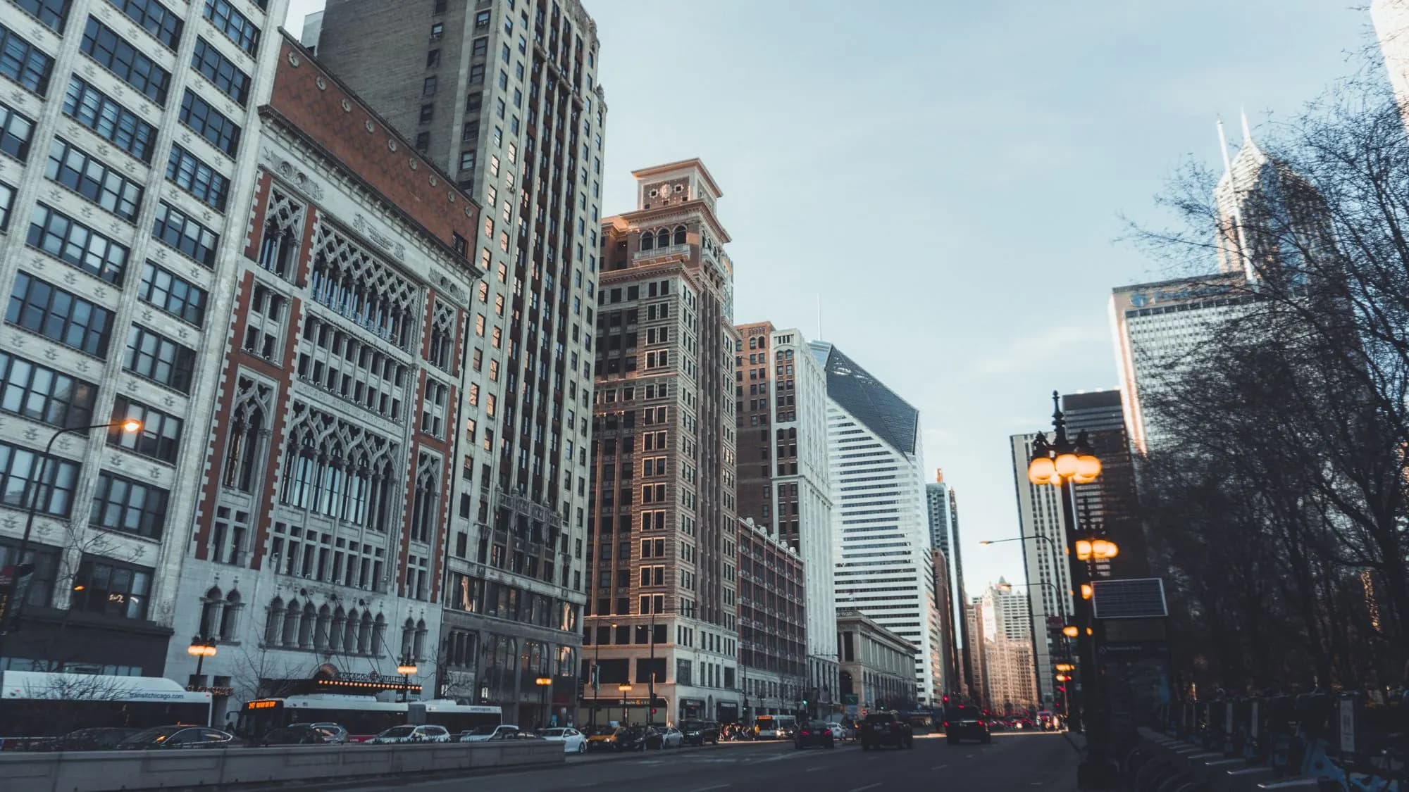 Michigan Avenue in Chicago lined with historic and modern towers at dusk